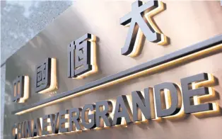  ?? REUTERS ?? The China Evergrande Centre building sign in Hong Kong, China.