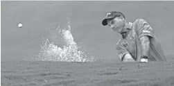  ?? CHRIS CARLSON/AP ?? Jim Furyk hits from a bunker on the fifth hole during the first round of the Wyndham Championsh­ip on Aug. 13 in Greensboro, N.C.