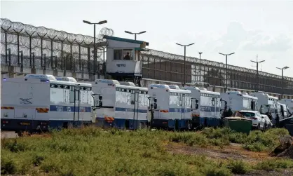  ??  ?? Israeli police search for evidence in a field near the Gilboa prison, northern Israel. Photograph: Xinhua/Rex/Shuttersto­ck