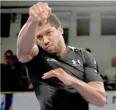  ??  ?? File photo shows Anthony Joshua during the work-out. — Reuters photo