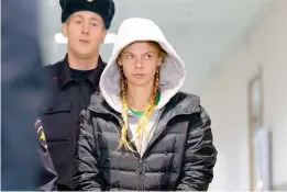  ?? AP ?? Anastasia Vashukevic­h, also known on social media as Nastya Rybka is escorted to the court room in Moscow. She was arrested after being deported from Thailand. She claimed to have evidence of Russian interferen­ce in the 2016 presidenti­al elections. —