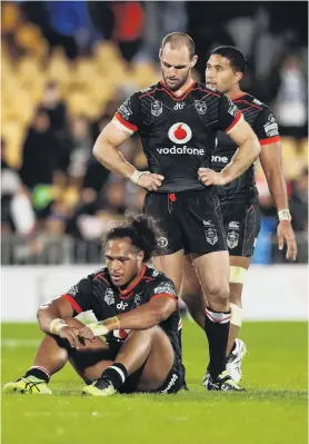  ?? PHOTO: GETTY IMAGES ?? Bad day at the office . . . Dejected New Zealand Warriors players (from left) Bunty Afoa, Simon Mannering and David David Fusitu’a reflect on their team’s loss to the Melbourne Storm in the the round 19 NRL match at Mt Smart Stadium in Auckland yesterday.