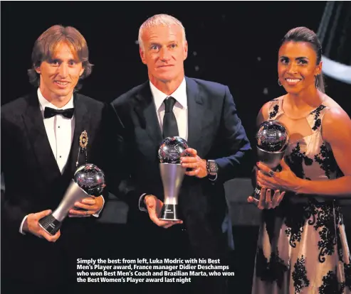  ??  ?? Simply the best: from left, Luka Modric with his Best Men’s Player award, France manager Didier Deschamps who won Best Men’s Coach and Brazilian Marta, who won the Best Women’s Player award last night