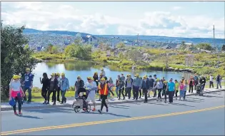  ?? LOUIS POWER/THE TELEGRAM ?? Young Adult Cancer Canada supporters make their way up Signal Hill in St. John’s Sunday in the 17th annual climb fundraiser.