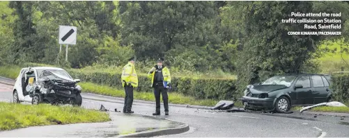  ?? CONOR KINAHAN/PACEMAKER ?? Police attend the road traffic collision on Station
Road, Saintfield