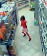  ??  ?? Split second before: An unsuspecti­ng Thusha is seen dancing through the aisles of her uncle's shop