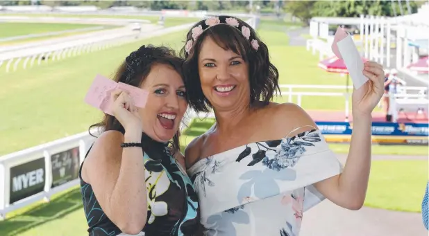  ?? Picture: ANNA ROGERS ?? ON THE MONEY: Kylie Dempsey and Karen Donato celebrate a win at the races at Cannon Park.