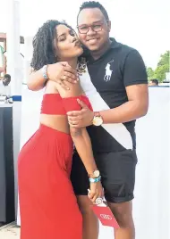  ??  ?? Director of WETswim and recording artiste Denyque (left) gets close to her spouse, Careem Mullings (director of 876 Terrace Bar and Grill).