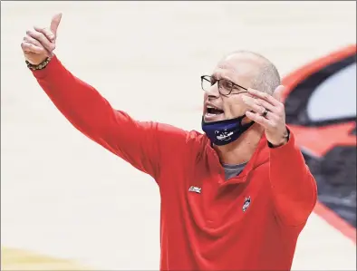  ?? Jessica Hill / Associated Press ?? UConn coach Dan Hurley calls out to the team during the first half against Southern California on Dec. 3.