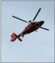  ??  ?? A helicopter flies above the Upper Dublin Township building on the second day of the junior police academy.