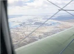  ?? AFP ?? An aerial view of the Kurgan region from an Antonov An-2 aircraft during a monitoring flight in an image released on Thursday.