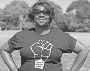  ?? PATRICIA MCKNIGHT/ MILWAUKEE JOURNAL SENTINEL ?? Rhonda Cook showcases her Black Lives Matter T-shirt.