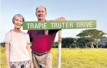  ?? ?? Juliana and son Julius Truter at the road sign that bears the name of her late husband, the first town clerk of Richards Bay