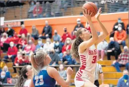  ?? KYLE TELECHAN / POST-TRIBUNE ?? Crown Point’s Lilly Stoddard, right, who is averaging 10.9 points and 9.0 rebounds this season, takes the ball to the basket past Fort Wayne Carroll’s Lexi Castator on Saturday.