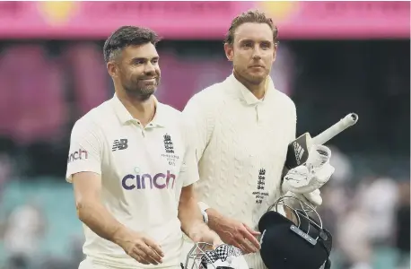  ?? ?? England’s James Anderson and Stuart Broad celebrate after a draw during day five of the fourth Ashes test at the Sydney Cricket Ground.