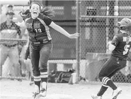  ?? GORDON RADFORD/CORRESPOND­ENT ?? Hagerty first baseman Gabi Mathre (13) jumps for joy after the last out of Thursday’s Class 8A softball state championsh­ip game at Historic Dodgertown in Vero Beach.