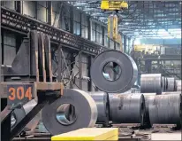  ?? CP PHOTO ?? A coil of steel is moved by a crane at the Direct Strip Production Complex at Essar Steel Algoma in Sault Ste. Marie, Ont.