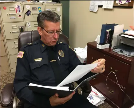  ?? FILE PHOTOS ?? Police Chief Paul Thompson looks over documents in his office on Wednesday, Oct. 23, 2019.