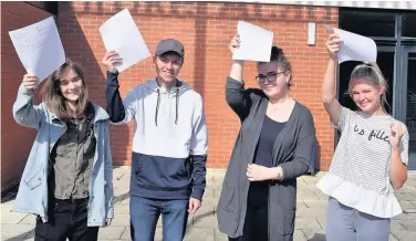  ??  ?? Students from OBA celebrate their A Level results. Pictured: Rebecca Fearn, three applied learning distinctio­n stars equivalent to A* and a B and off to study TV and radio; Danielle McGough, A and two Bs, off to Liverpool University to study biological...