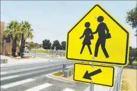  ?? Marcus Villagran ?? Las Vegas Review-journal @brokejourn­alist A new crosswalk in front of C.P. Squires Elementary School in North Las Vegas is designed to improve pedestrian safety.