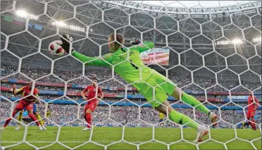  ?? ALASTAIR GRANT/AP PHOTO ?? England goalkeeper Jordan Pickford makes a save from Sweden’s Marcus Berg during England’s 2-0 win in the World Cup quarterfin­als on Saturday in Samara, Russia. England will play Croatia in Wednesday’s semifinals.