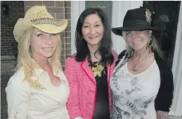  ??  ?? In attendance at the home of Greg and Shirley Turnbull were, from left, Mawer Investment­s’ Denise Gladwell, Wong & Associates’ Debra Wong and author and founder of Mitchell Gourmet Foods LuAn Mitchell, who now resides in California.