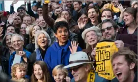  ?? Stephanie Strasburg/Post-Gazette ?? In 2016, Phylicia Rashad (waving, center) joined Pittsburgh­ers in New York City’s Times Square for the Pittsburgh on Broadway photo.