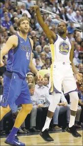  ?? PHOTOS BY LM OTERO — ASSOCIATED PRESS ?? The Warriors Kevin Durant, right, watches his shot go into the basket against the Mavericks’ Dirk Nowitzki.