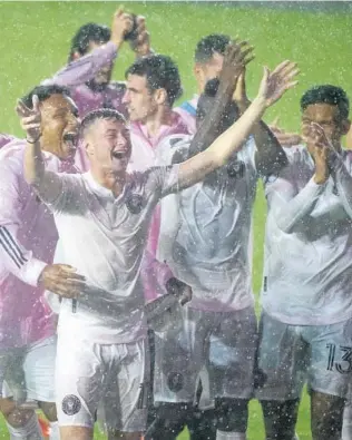  ?? DAVID SANTIAGO/AP ?? Inter Miami CF celebrates its big win on a rainy Sunday.