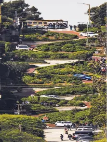  ?? Gabrielle Lurie / The Chronicle ?? Driving the crooked block of Lombard Street will remain free now that Gov. Gavin Newsom vetoed a proposed fee system.