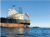  ??  ?? POTENTIAL DISASTER: The tugboat towing an empty oil tanker was stranded off Cape St Francis at the weekend