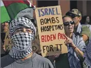  ?? Mel Melcon Los Angeles Times ?? PROTESTERS gather outside the Israeli Consulate in Los Angeles before the start of the march.