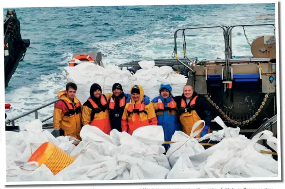  ??  ?? Above: The Offshore Shellfish team Below: Harvesting on a stormy day
Opposite: Bagging the harvest
(photos: Offshore Shellfish)