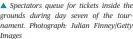  ?? Photograph: Julian Finney/Getty Images ?? Spectators queue for tickets inside the grounds during day seven of the tournament.