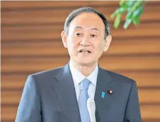  ?? — AFP photos ?? Japan’s Prime Minister Yoshihide Suga speaks to reporters as he congratula­tes Hideki Matsuyama on winning the Masters at the prime minister’s office in Tokyo.