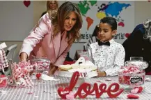  ?? Susan Walsh / Associated Press ?? First lady Melania Trump talks with Josue at the Children’s Inn during her visit to the National Institutes of Health.