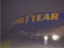  ??  ?? The Goodyear Blimp “Sprit of Innovation” is deflated early Tuesday.