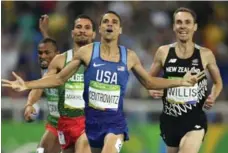  ?? FABRICE COFFRINI/AFP/GETTY IMAGES ?? Matt Centrowitz of the U.S. wins the men’s 1500-metre final, followed by Algeria’s Taoufik Makhloufi, left, at the Rio 2016 Olympic Games.