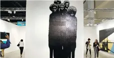  ??  ?? Witness, by Sanford Biggers, features African figurines casting shadows on a wall. The importance of gaining access to art fairs like Art Basel Miami Beach goes beyond simply showing one’s work.