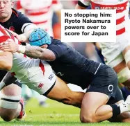  ??  ?? No stopping him: Ryoto Nakamura powers over to score for Japan