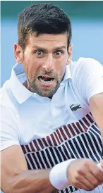  ?? AP. ?? Novak Djokovic returns a shot in his fourth round match against Albert Ramos-Vinolas yesterday.