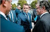 ?? LIONEL BONAVENTUR­E/AP ?? French presidenti­al candidate Emmanuel Macron, center, arrives Monday for a ceremony marking the 102nd anniversar­y of the slaying of Armenians by Ottoman Turks.