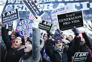  ?? ALEX WONG / GETTY IMAGES ?? Pro-life and pro-choice activists gather in front of the U.S. Supreme Court in 2015. As another U.S. Supreme Court seat opens up, some fear a more conservati­ve bench will overturn the Roe v. Wade decision that legalized abortion.