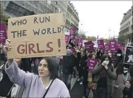  ?? Adrienne Surprenant Associated Press ?? PEOPLE gather in Paris this month to decry violence against women. More than 200,000 women a year are physically or sexually abused in France, estimates show.