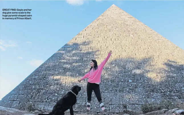  ??  ?? GREAT FIND: Gayle and her dog give some scale to the huge pyramid-shaped cairn in memory of Prince Albert.