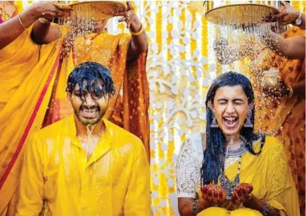 Niharika and Chaitanya during the Mangala Snanam, a pre-wedding ritual,  done during the Haldi ceremony in which the bride and groom take an  auspicious bath before their wedding day, to purify themselves