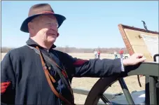  ?? TIMES photograph by Annette Beard ?? Paul Dolle of Rogers, who held the rank of sergeant in charge of the gun crew, said he’s been interested in the Civil War since the 1950s and 1960s and has been involved in staging re-enactments of Civil War battles for nearly 50 years. Dolle said he’s...