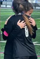  ?? Keith Barnes/Tri-State Sports Service ?? Avonworth senior defender Maura Logan is comforted by senior forward Ava Wert (No. 8) after the game.