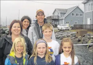  ?? SUBMITTED PHOTO ?? Parents and participan­ts are all smiles as they stand on the jetty with the Northern Yacht Club buildings in the background. From left to right are, front, Claire Phillips, Julia Downey and Poppy Maclean; middle, Janice Downey and Cameron Dunn and...