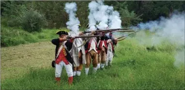  ?? BILL RETTEW — DIGITAL FIRST MEDIA ?? The 1st Delaware Regiment fires muskets on the 241st anniversar­y of the Battle of Brandywine.